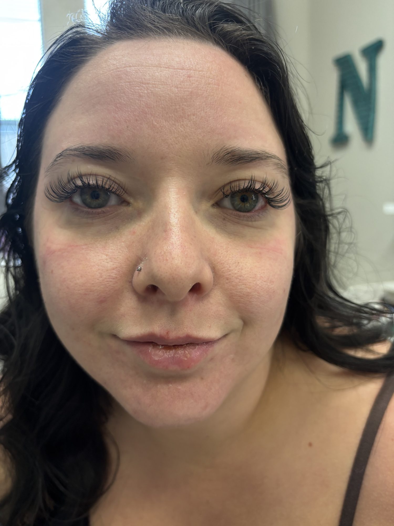 Client with long, defined lash extensions
