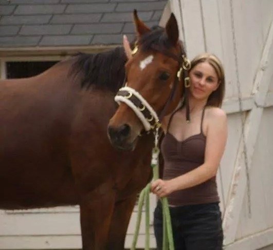 A Day Dreams Farm volunteer with a rescued horse