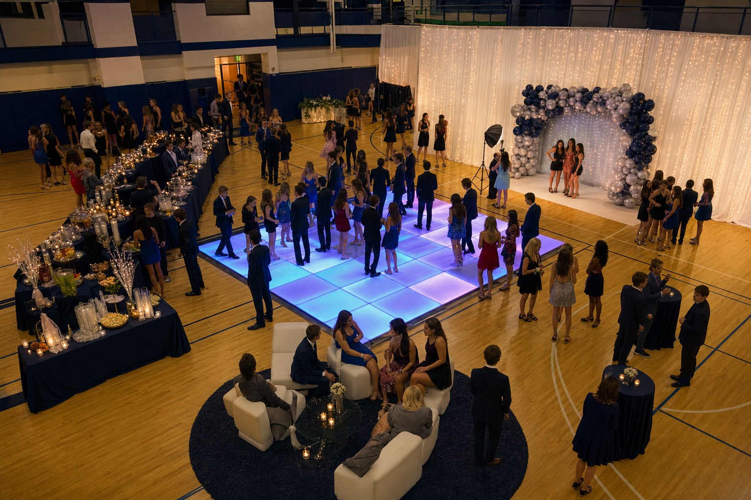 High school homecoming layout with an LED dance floor, photo backdrop, refreshments, lounge seating, and clear walking routes