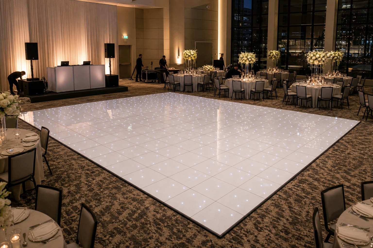 An illuminated LED dance floor prepared in an indoor event venue before guests arrive