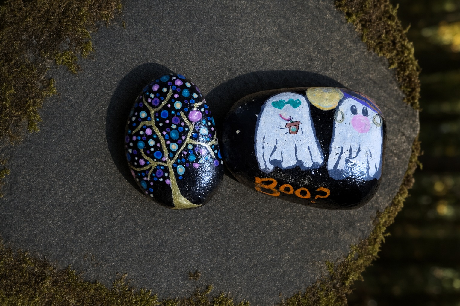 Ghost couple and dotted tree painted rock pair on dark slate