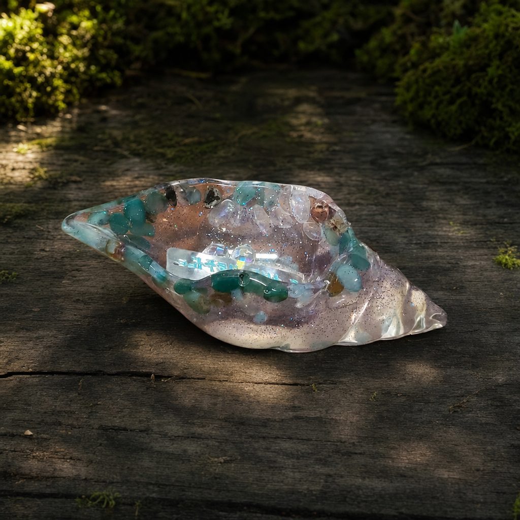 Elongated glimmer resin shell catch-all with naturally green river stones around the rim