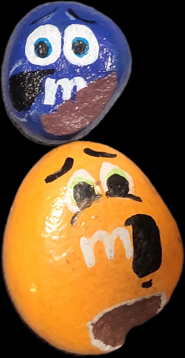 Orange and blue chocolate candy character stones with painted bites missing