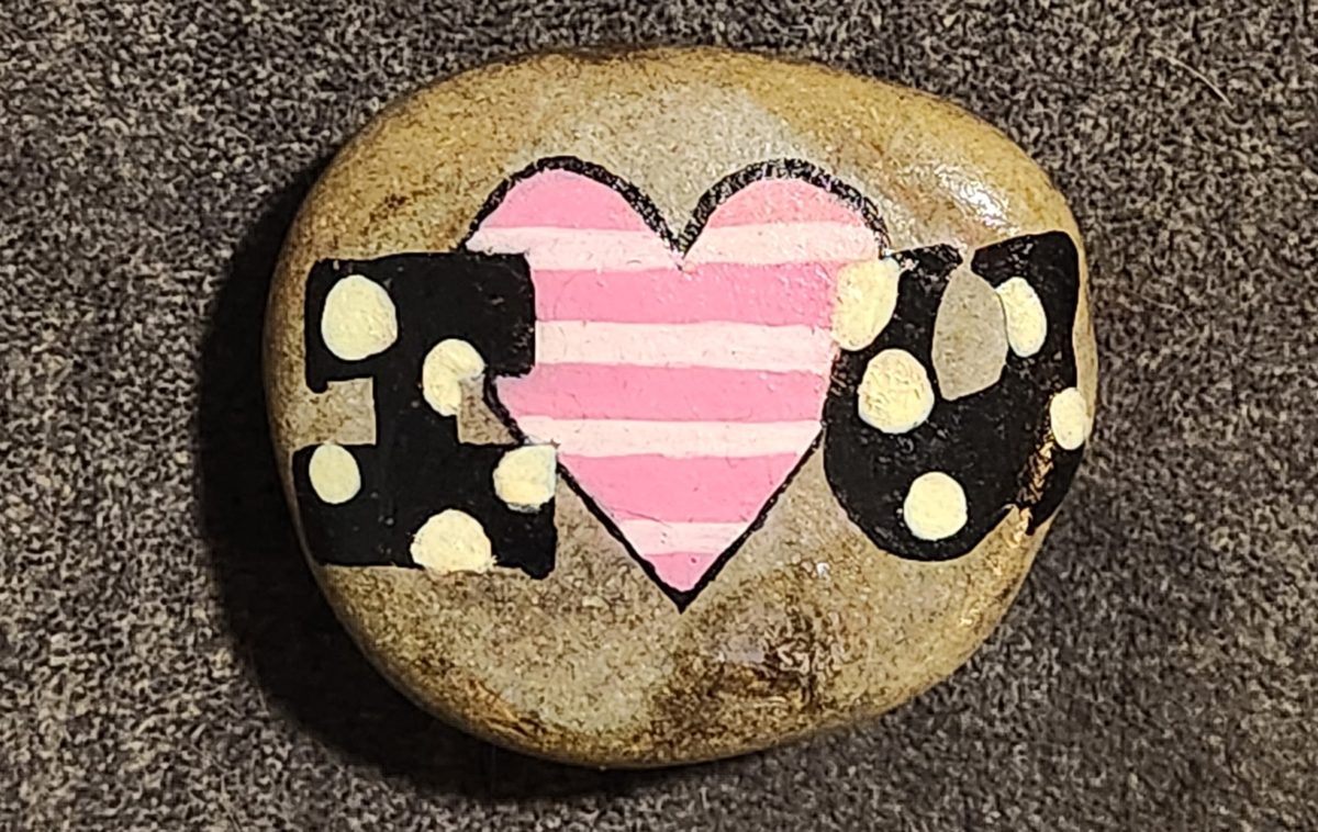 Hand-painted I love you rock with a striped pink heart and gold accents
