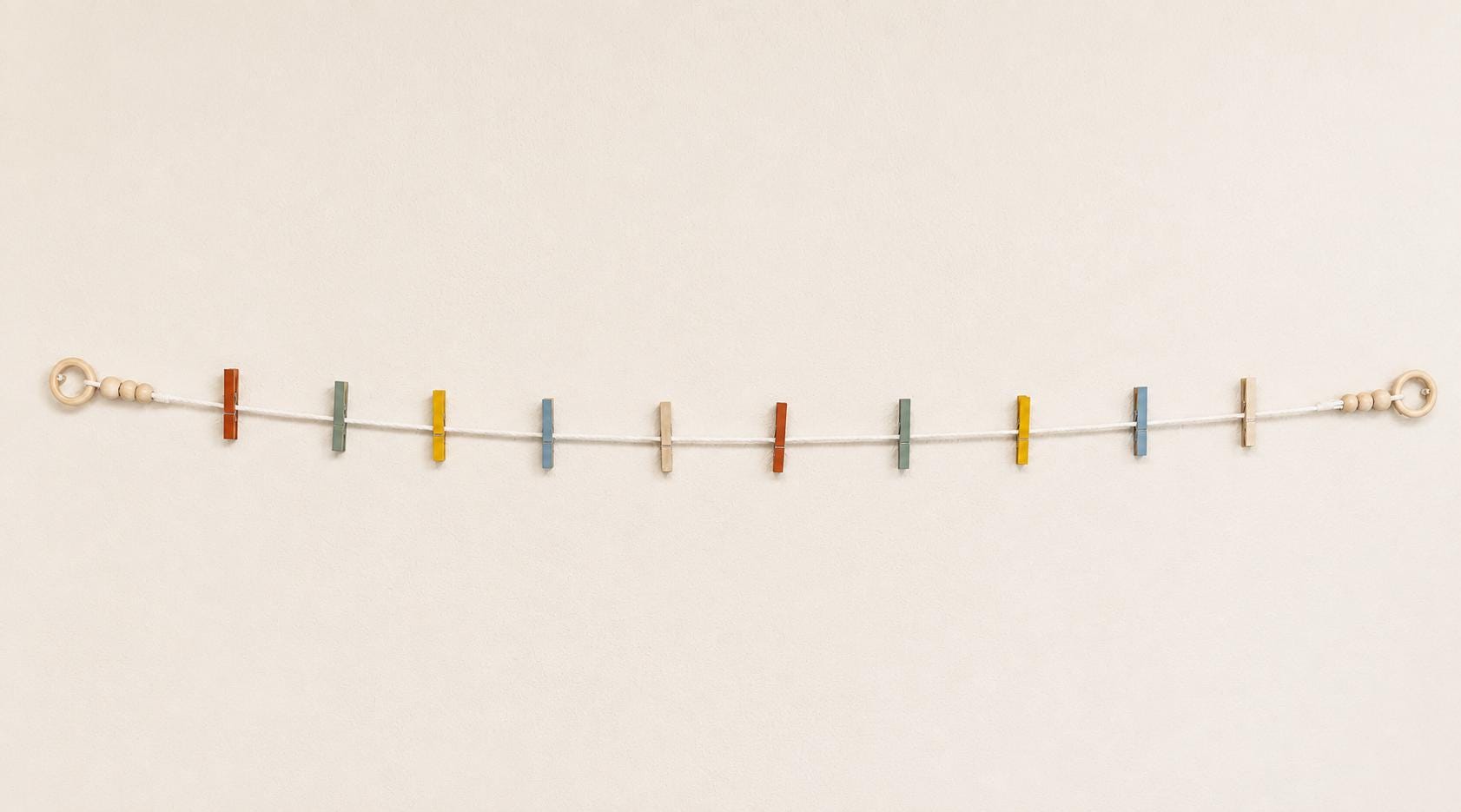 Handmade Kids Art Display Garland, Vintage Rainbow Clothespin Wall Decor displayed with children's artwork
