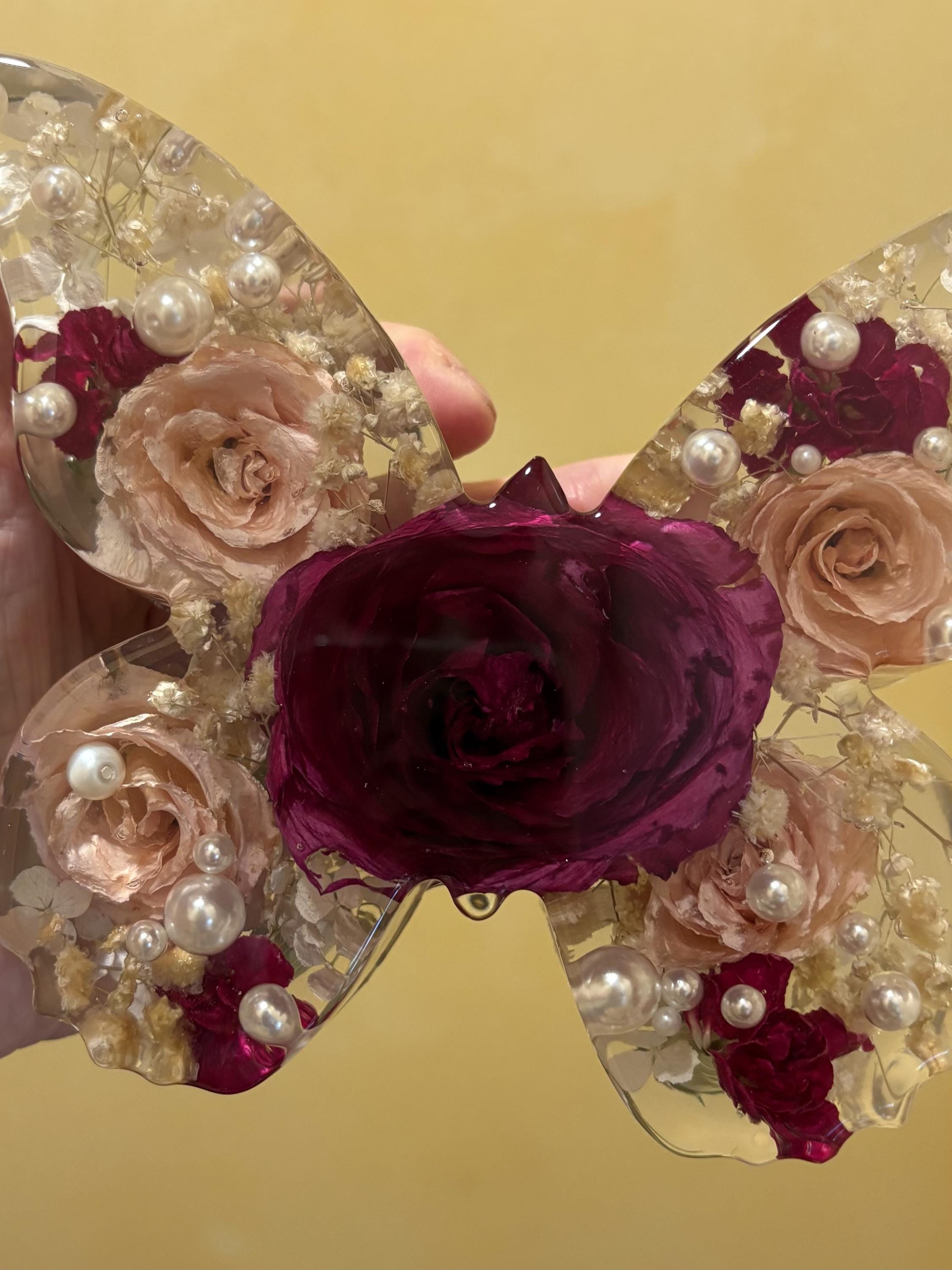 Illustrative floral resin keepsake in warm gallery light