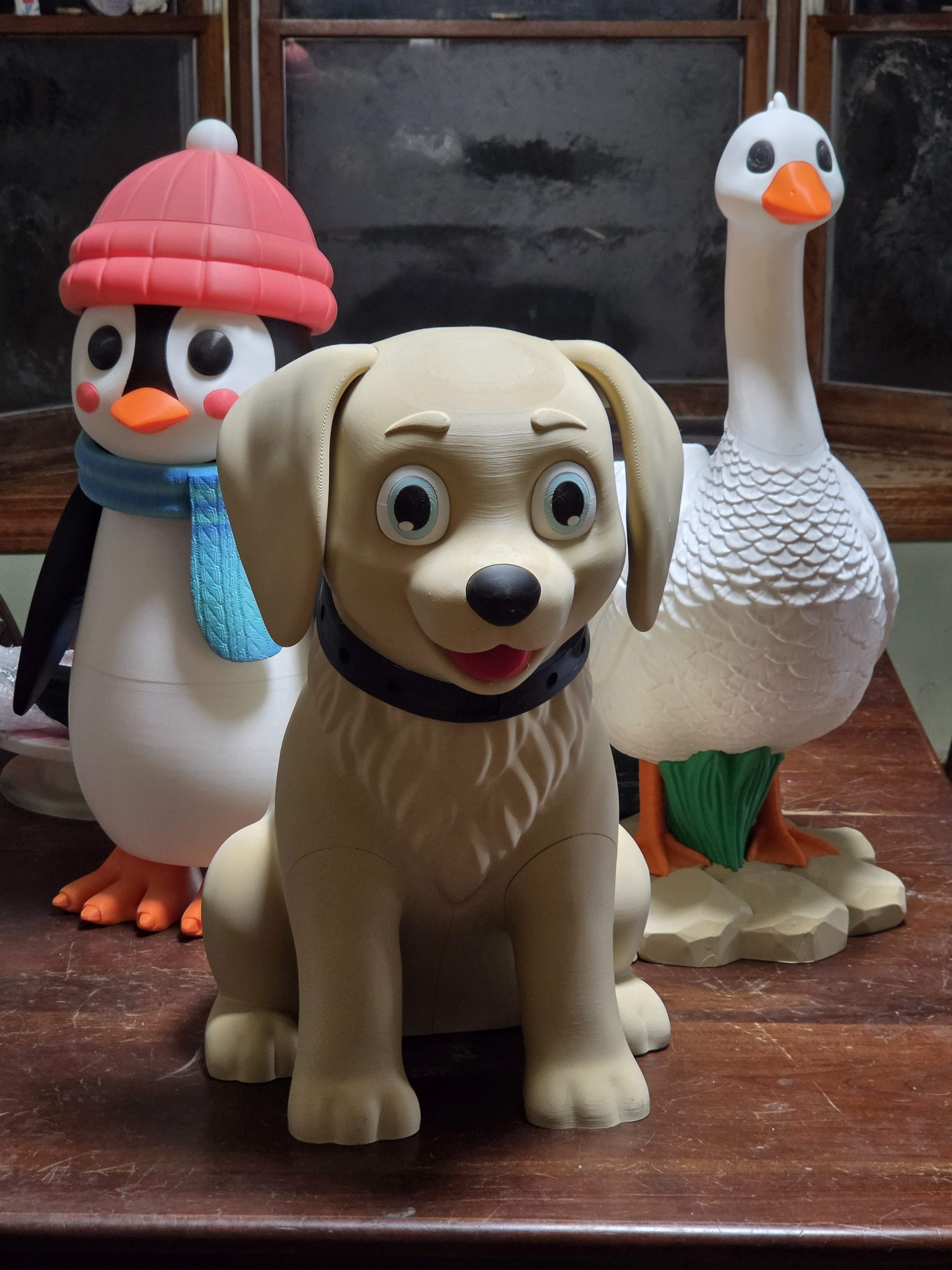 Collection of printed dog, penguin, and goose figures