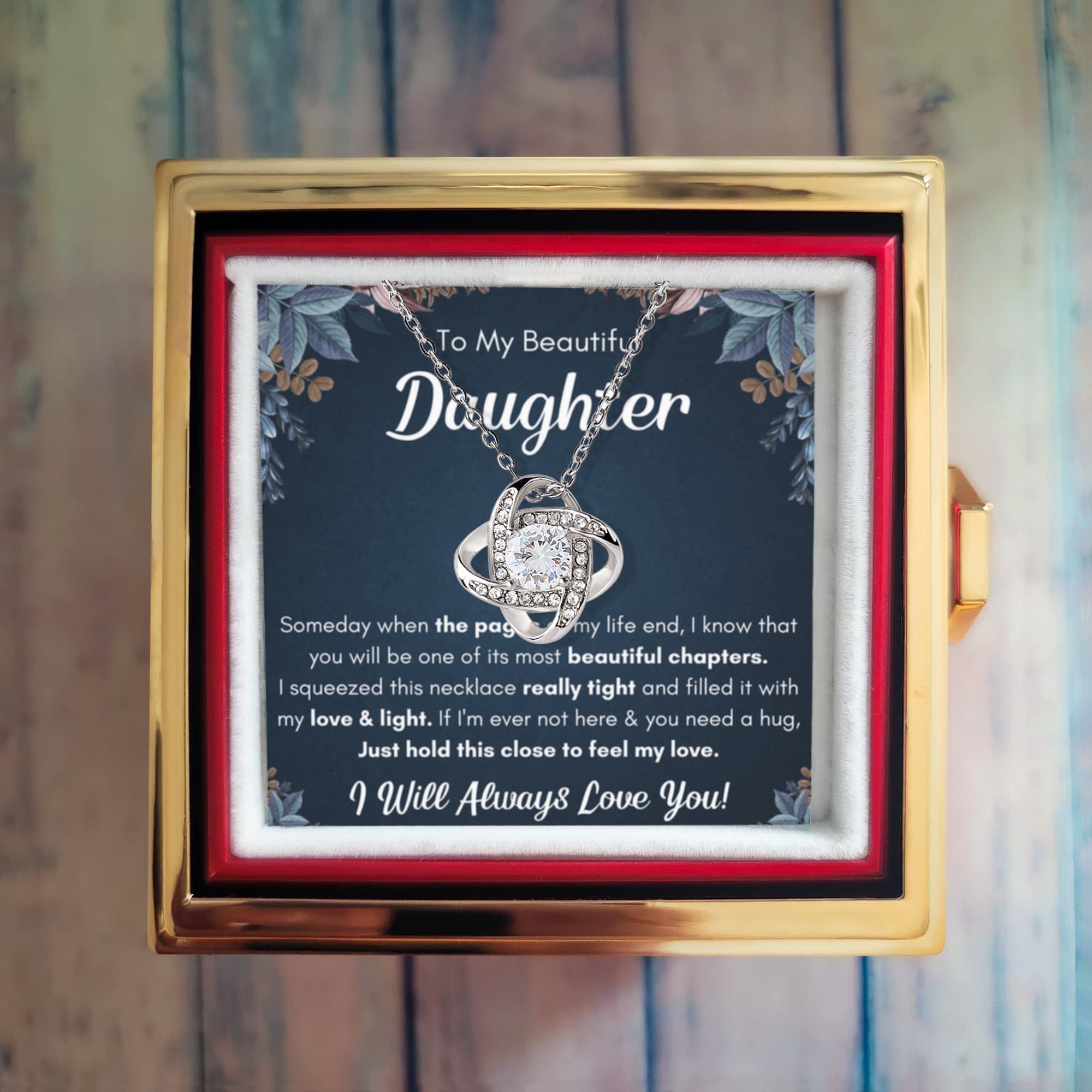 Daughter necklace revealed in a rotating rose gift box