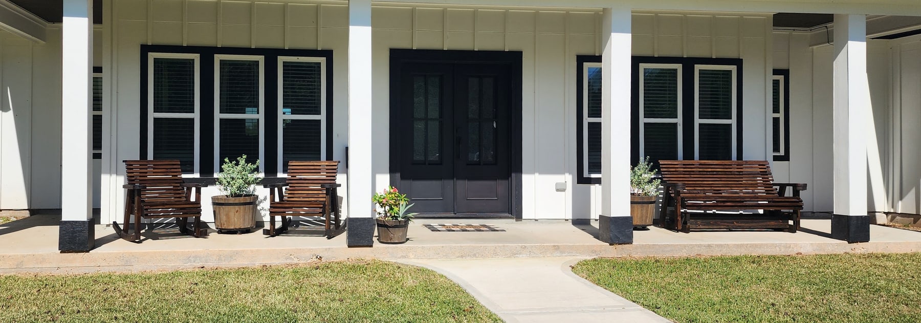 Cedar porch seating outside a farmhouse