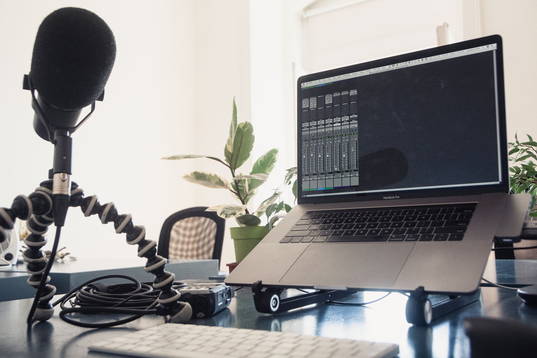 Microphone and laptop set up for an audio production review