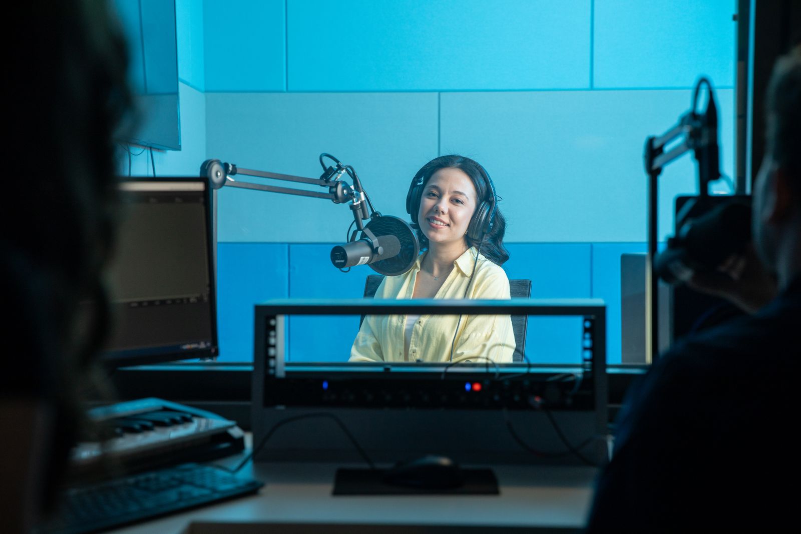 Podcast host recording in a professional studio
