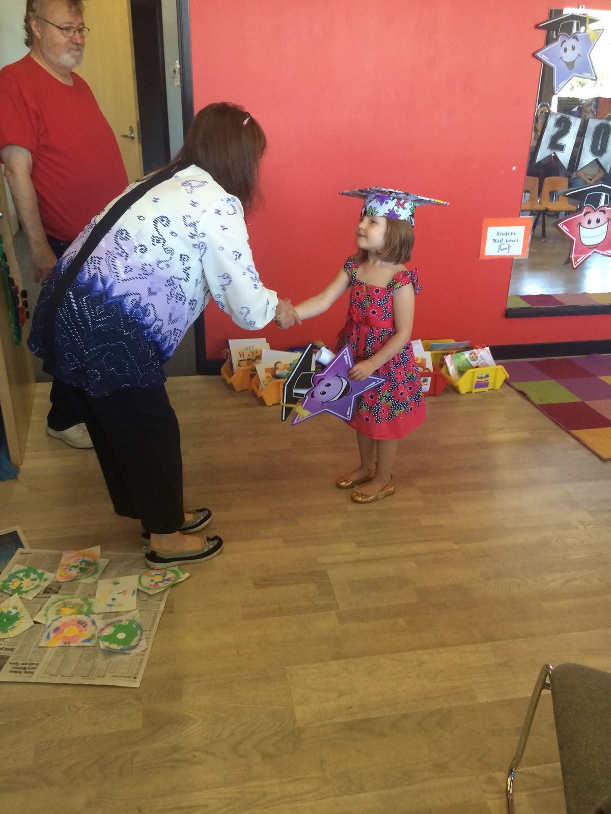 A Rising Stars Preschool child celebrating graduation