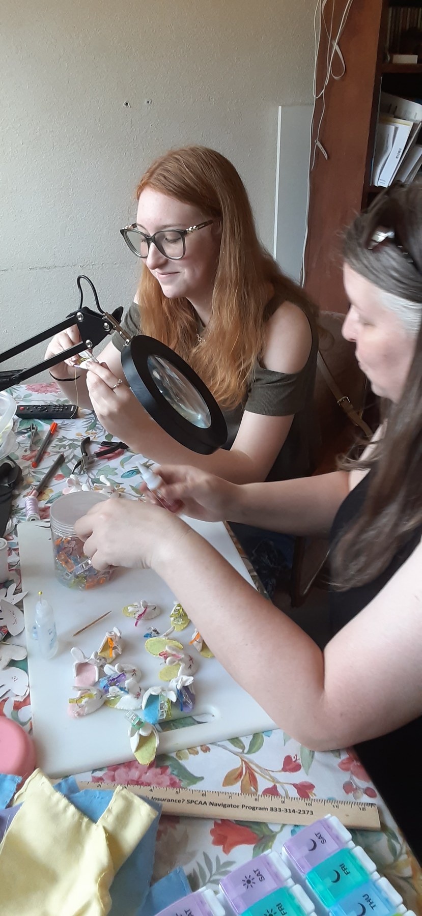 Family members making handmade pieces together at the craft table