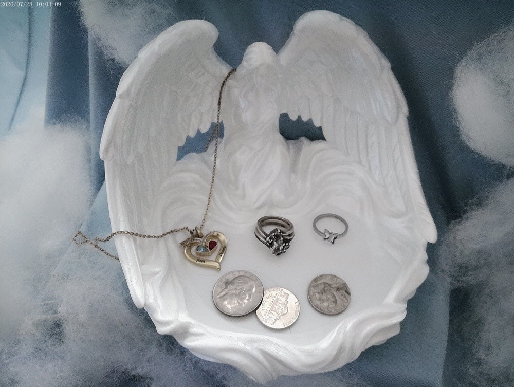 A white angel wings trinket tray for rings and small keepsakes
