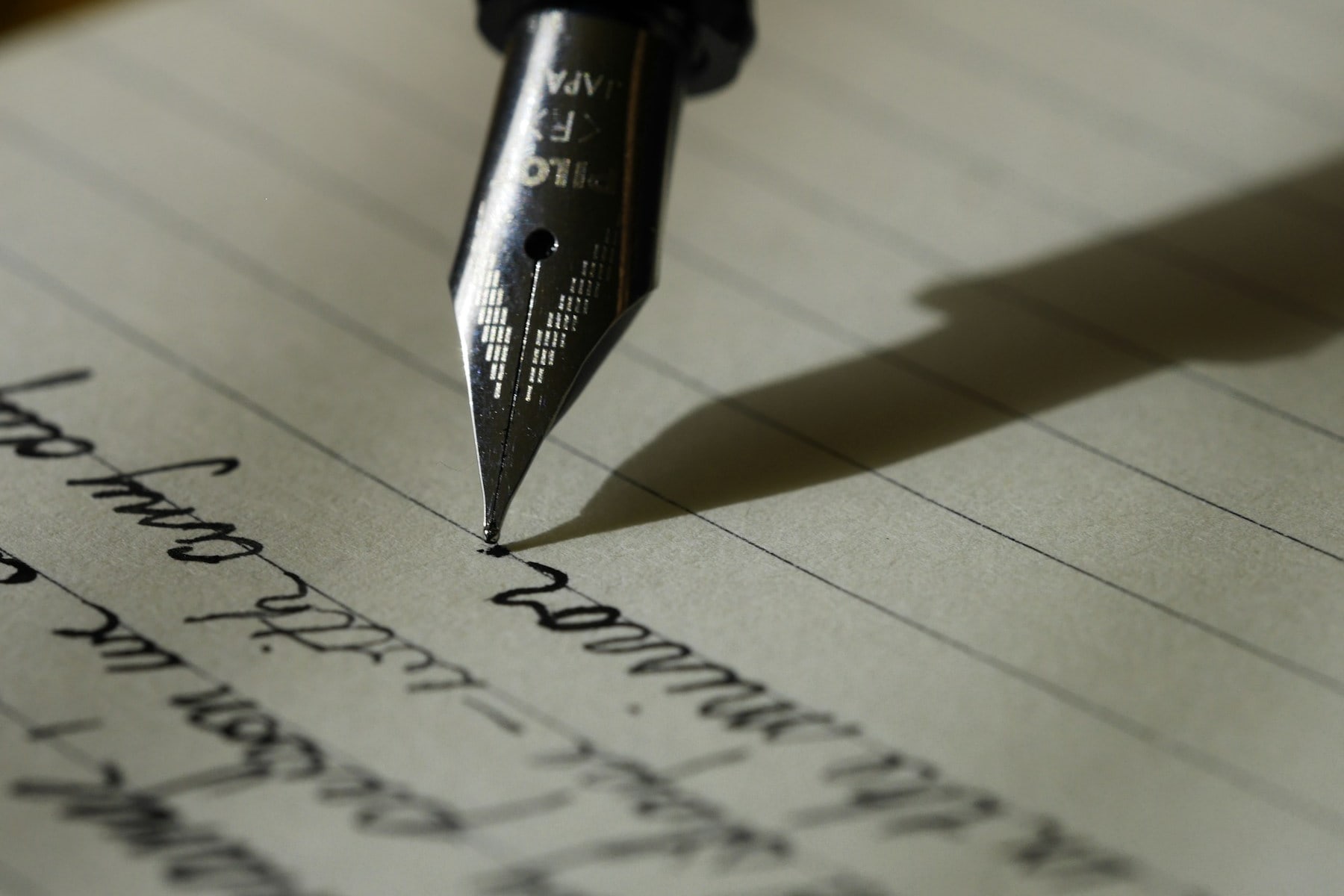 Fountain pen writing in a notebook