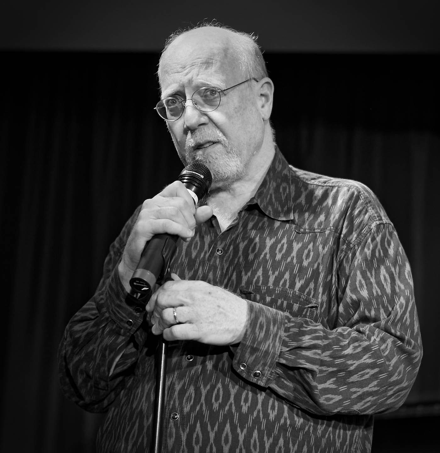 Michael Jefry Stevens at a microphone