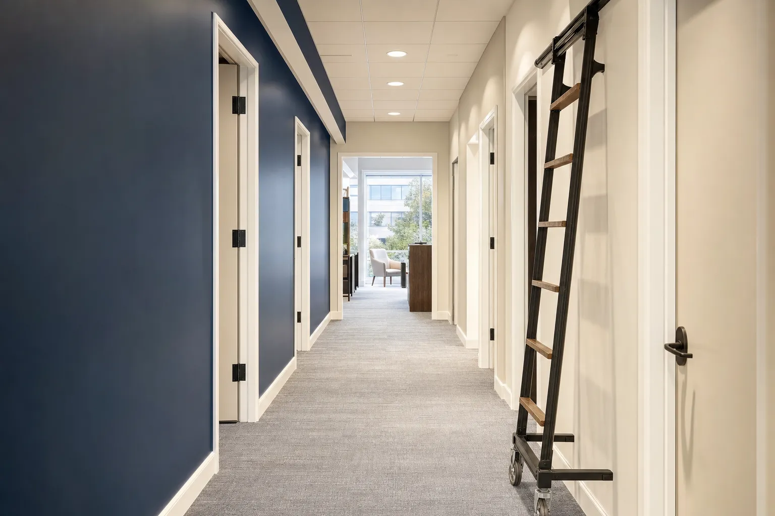 Freshly repainted office corridor with navy accent wall and clean white trim