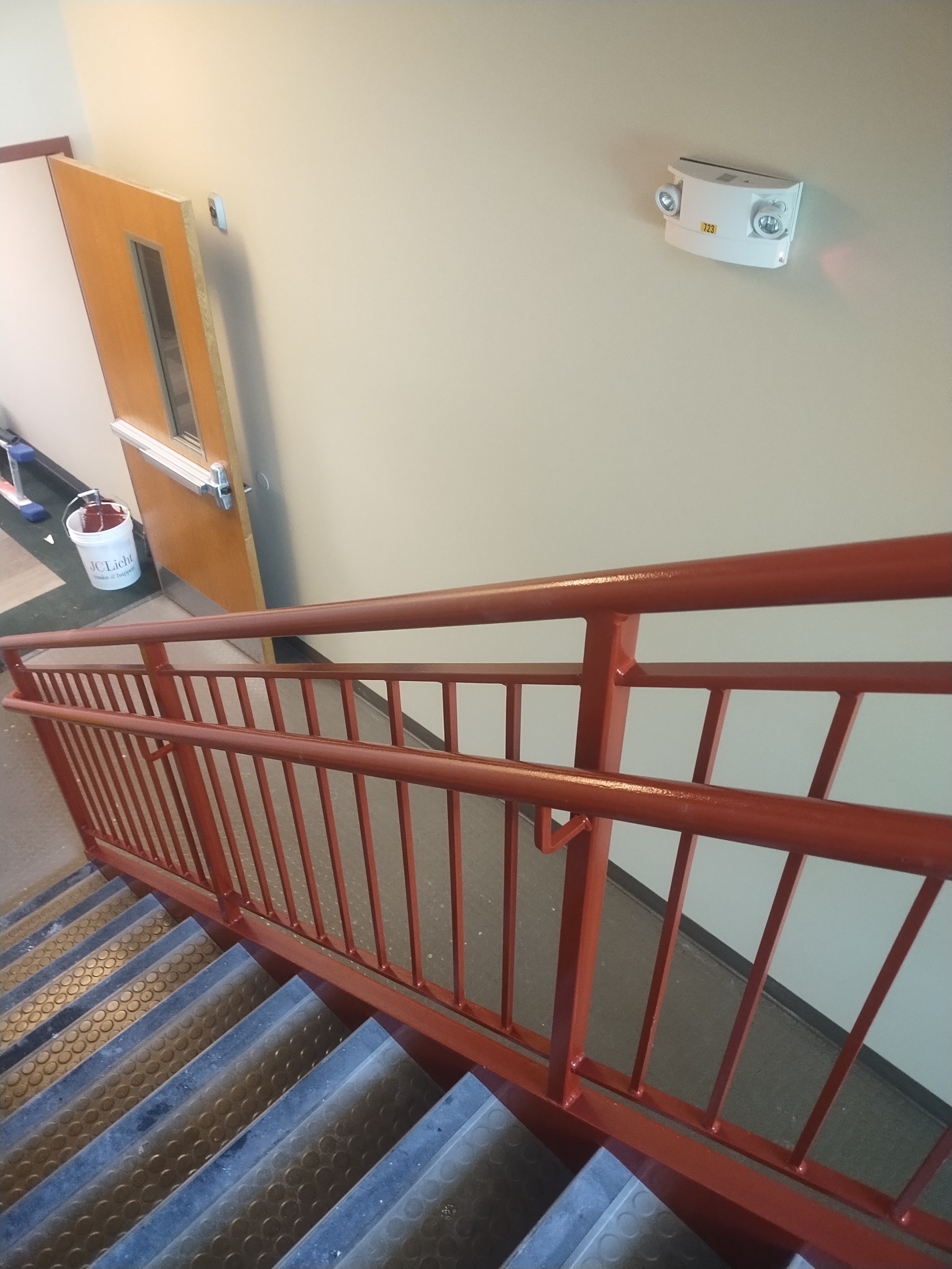Completed red stair railing at a Barrington commercial property