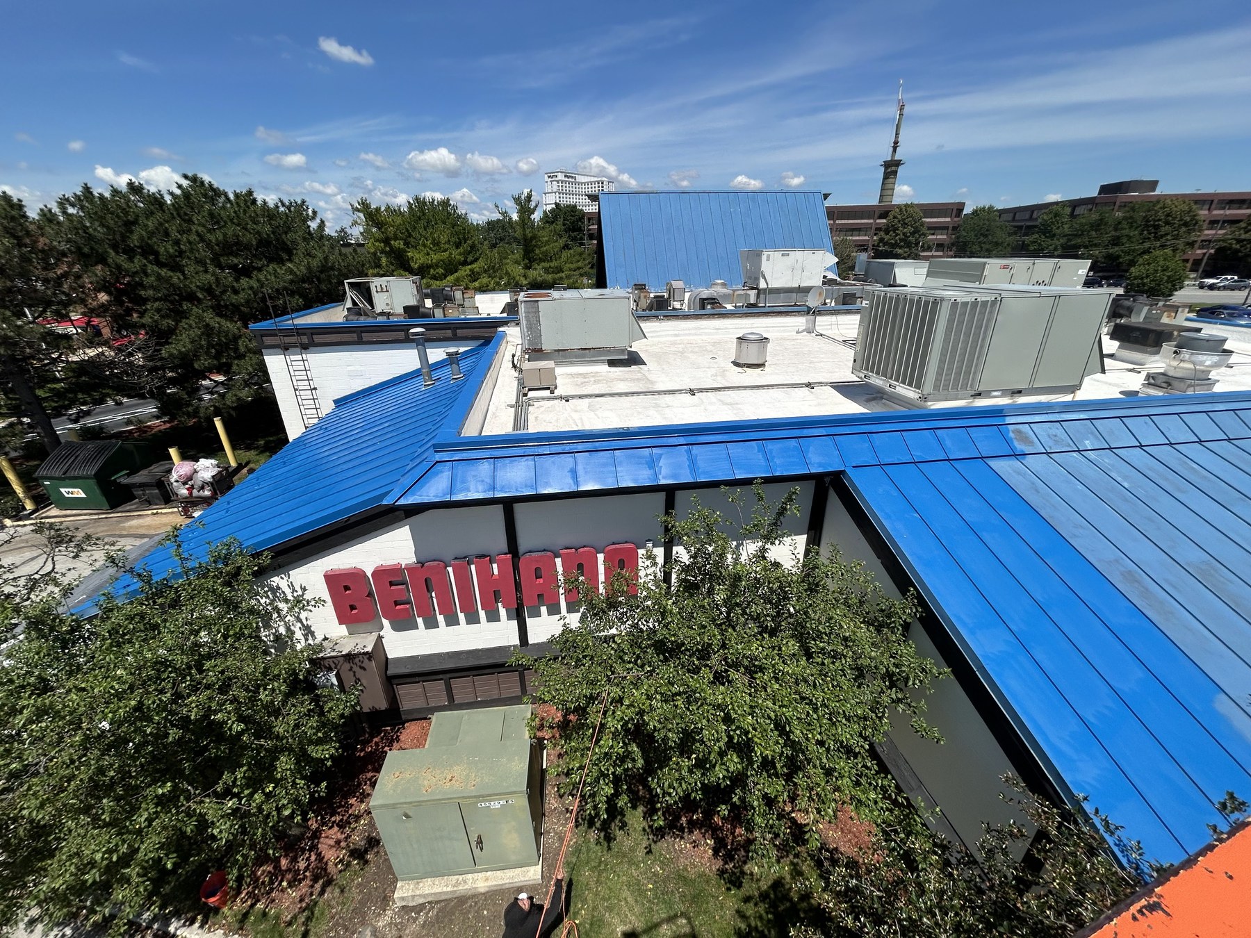 Aerial view of Benihana's bright blue metal roof