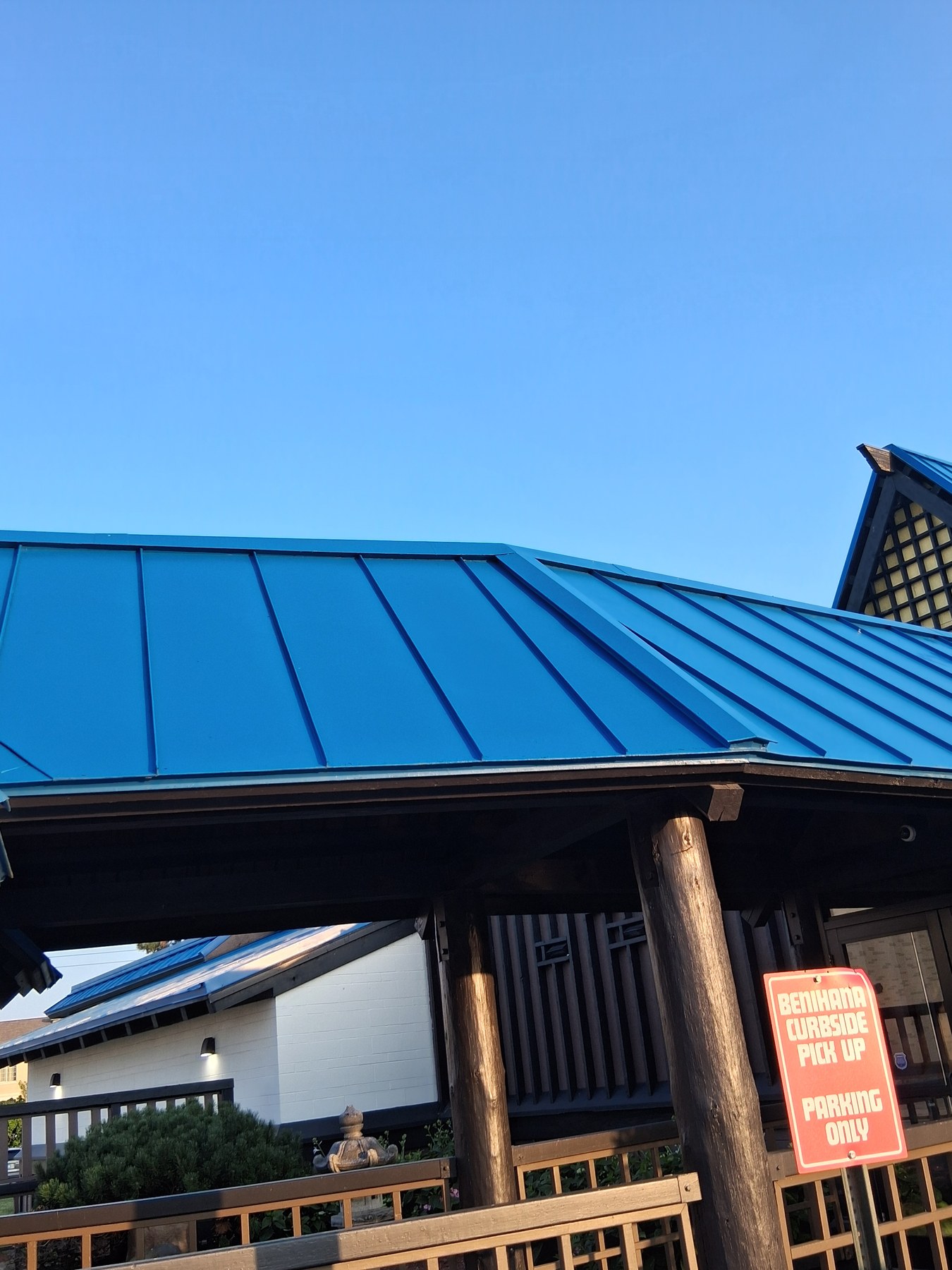 Blue metal roof above Benihana's entrance