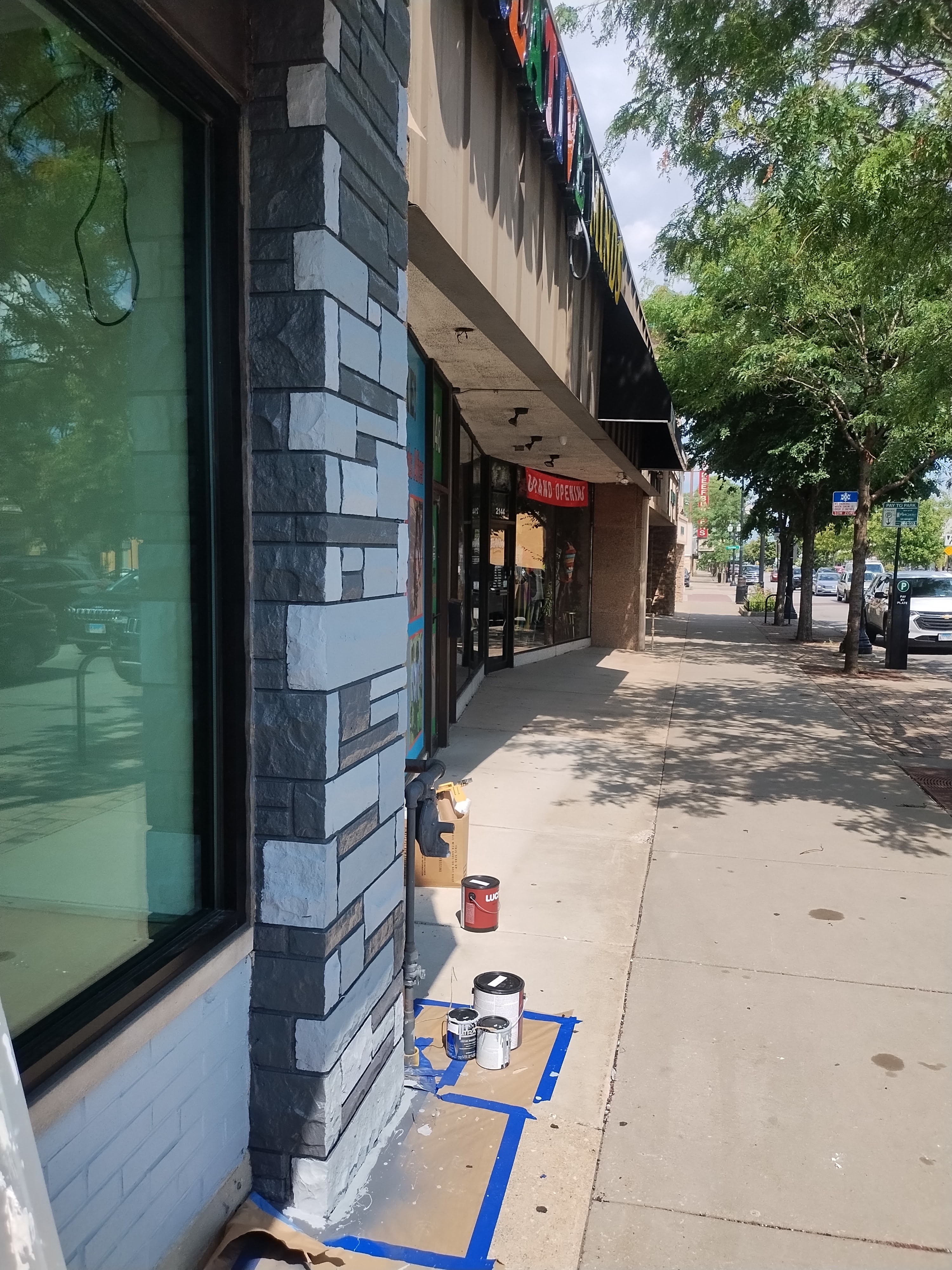 Protected commercial brickwork during custom exterior painting
