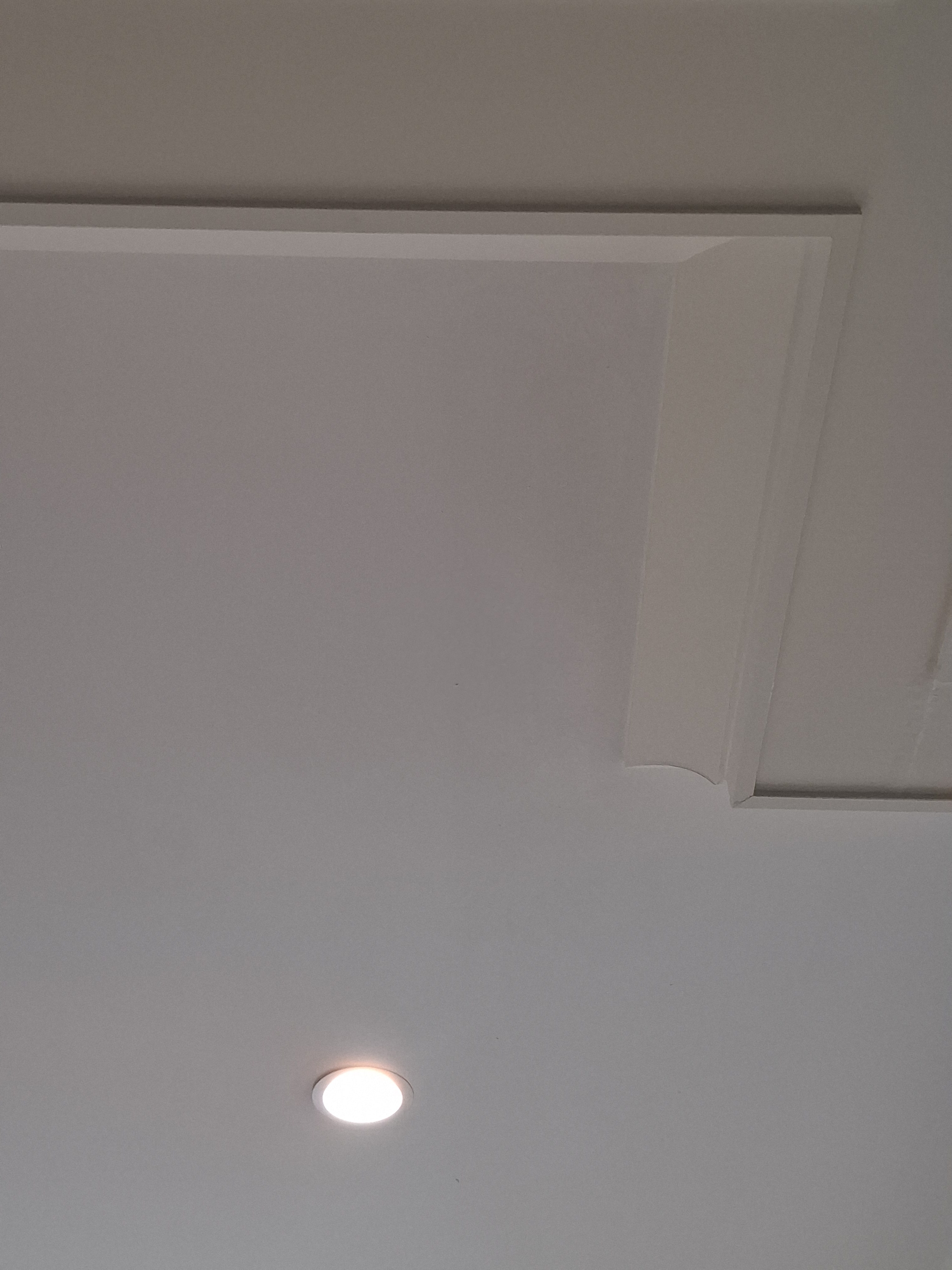 Smooth ceiling finish with recessed lighting