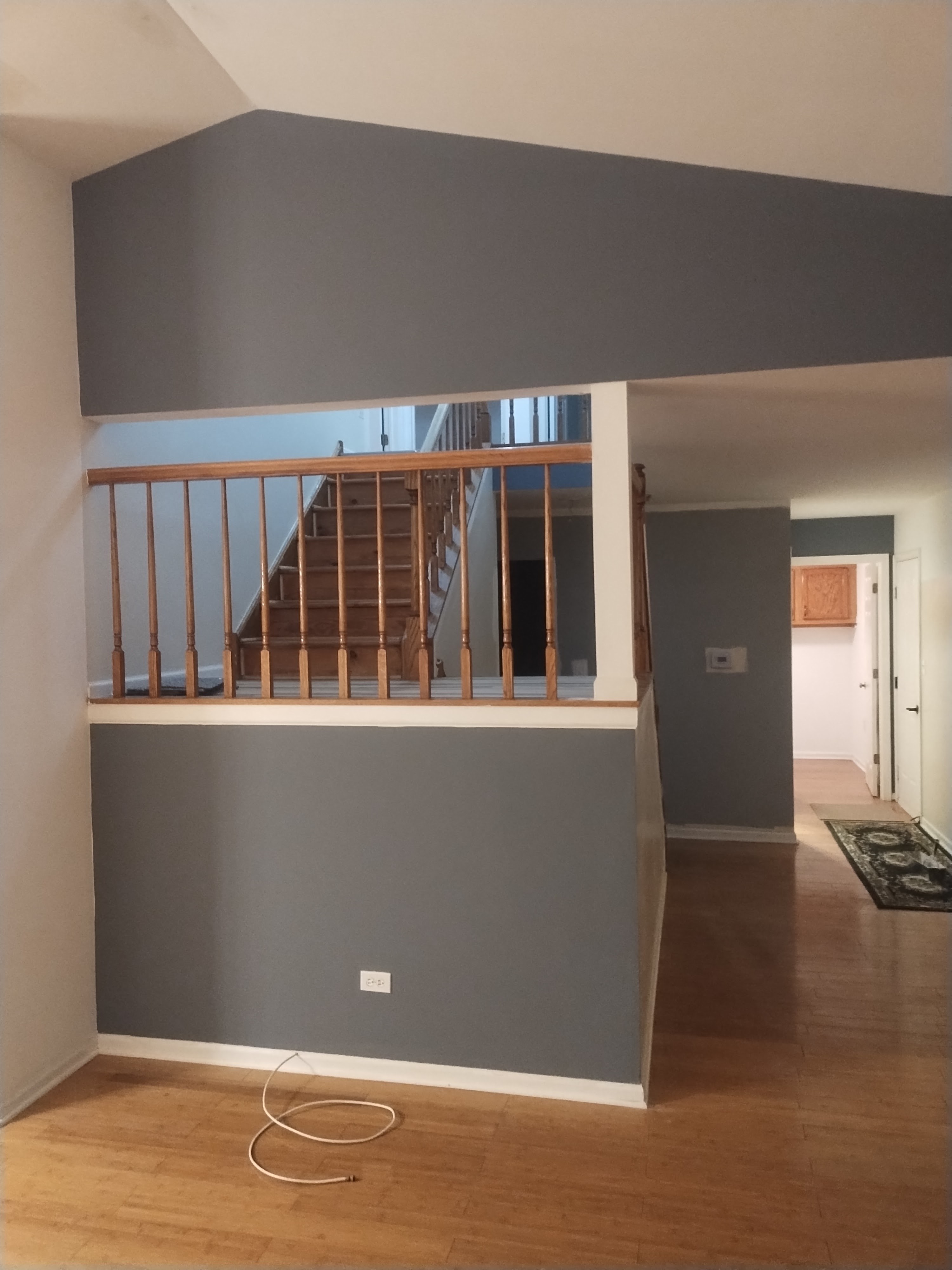 Living room accent wall and stair opening
