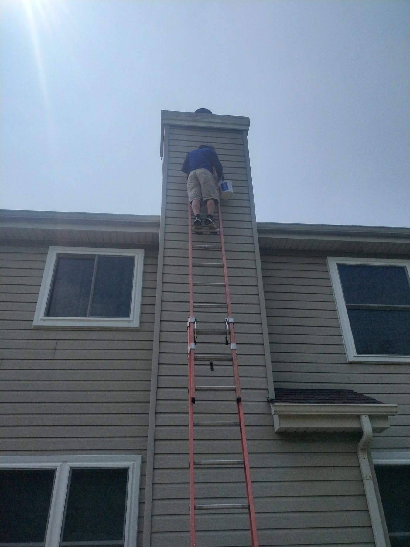Exterior repaint in progress at a McHenry home