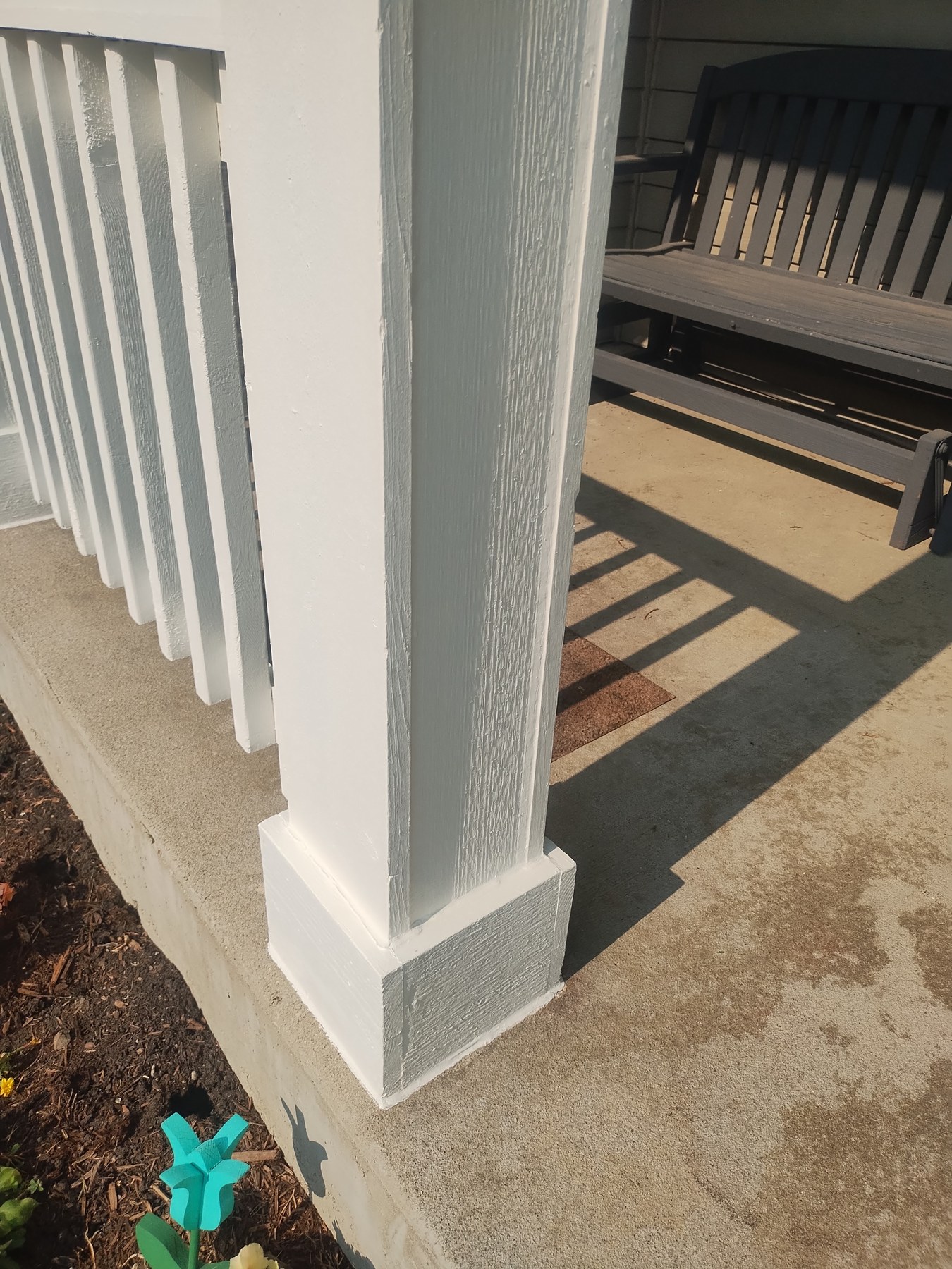 Fresh exterior paint around a garage door
