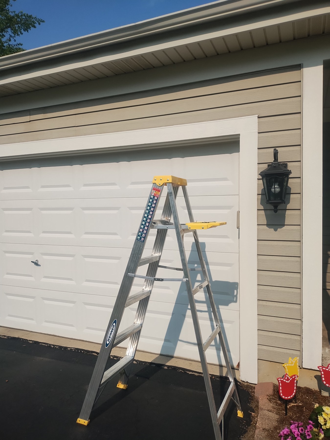Finished white trim against gray siding