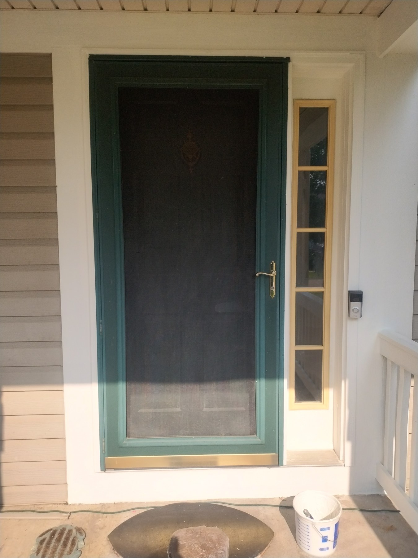 Completed exterior porch, white trim, and gray siding in McHenry