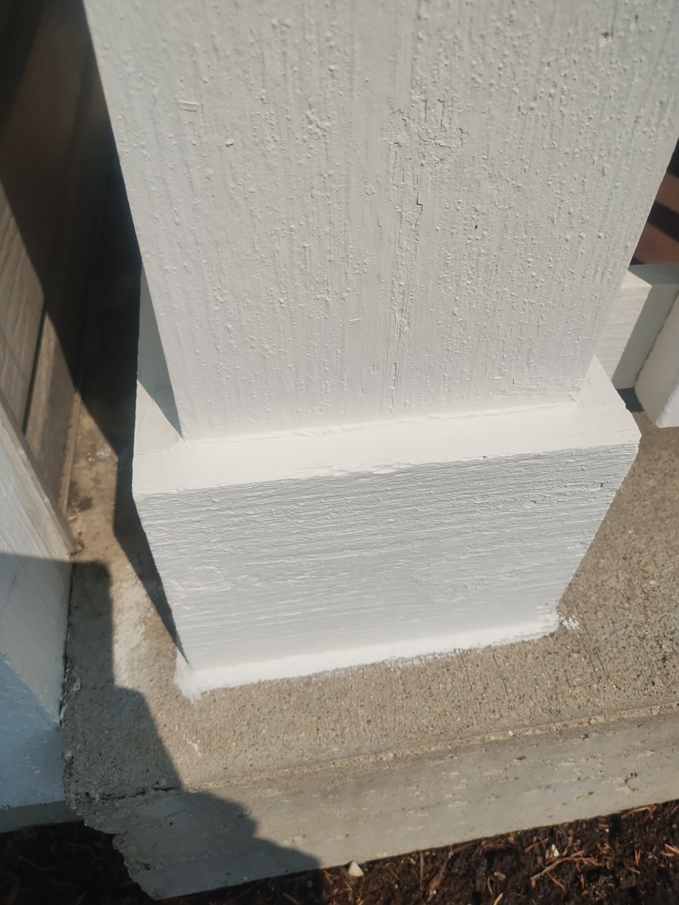 Exterior painter working high on the home