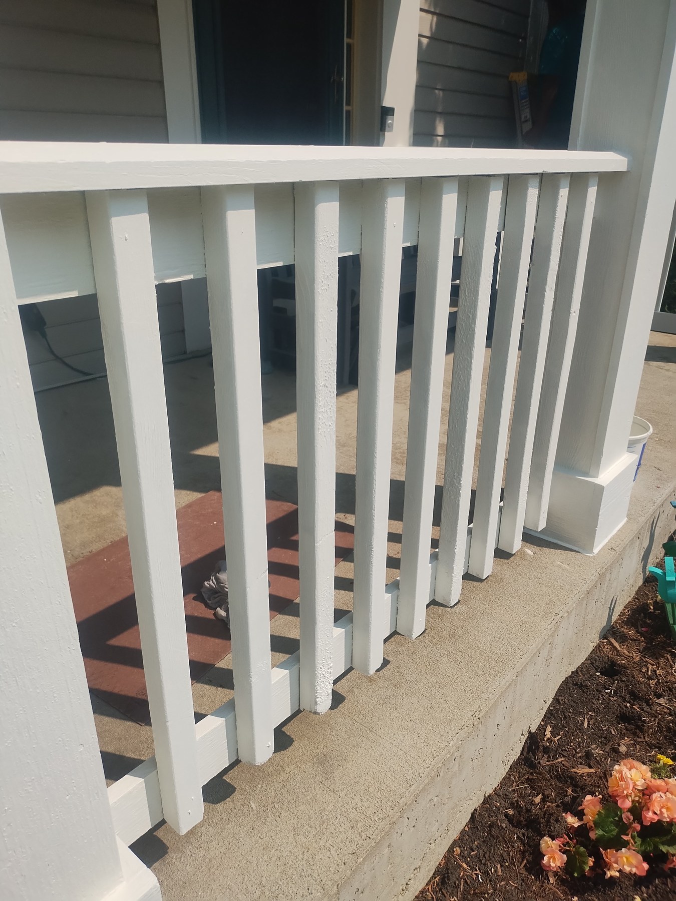 Fresh white paint on an exterior porch column