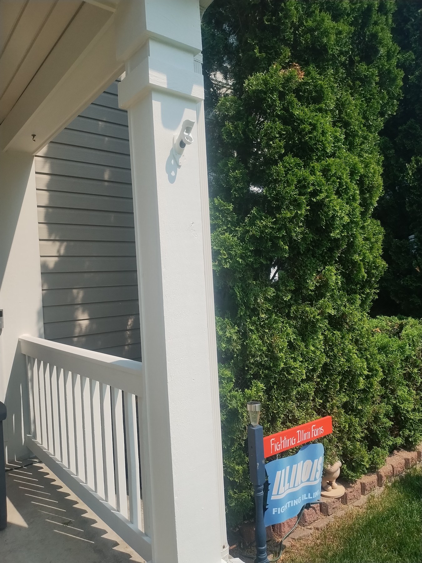 Freshly painted porch column and railing