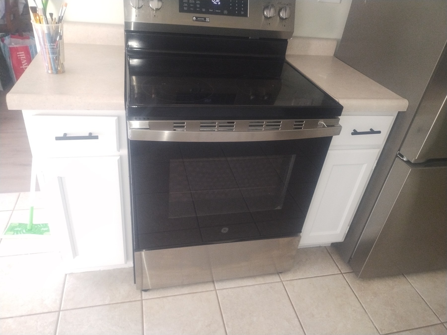 Refinished cabinet finish at a cooking area