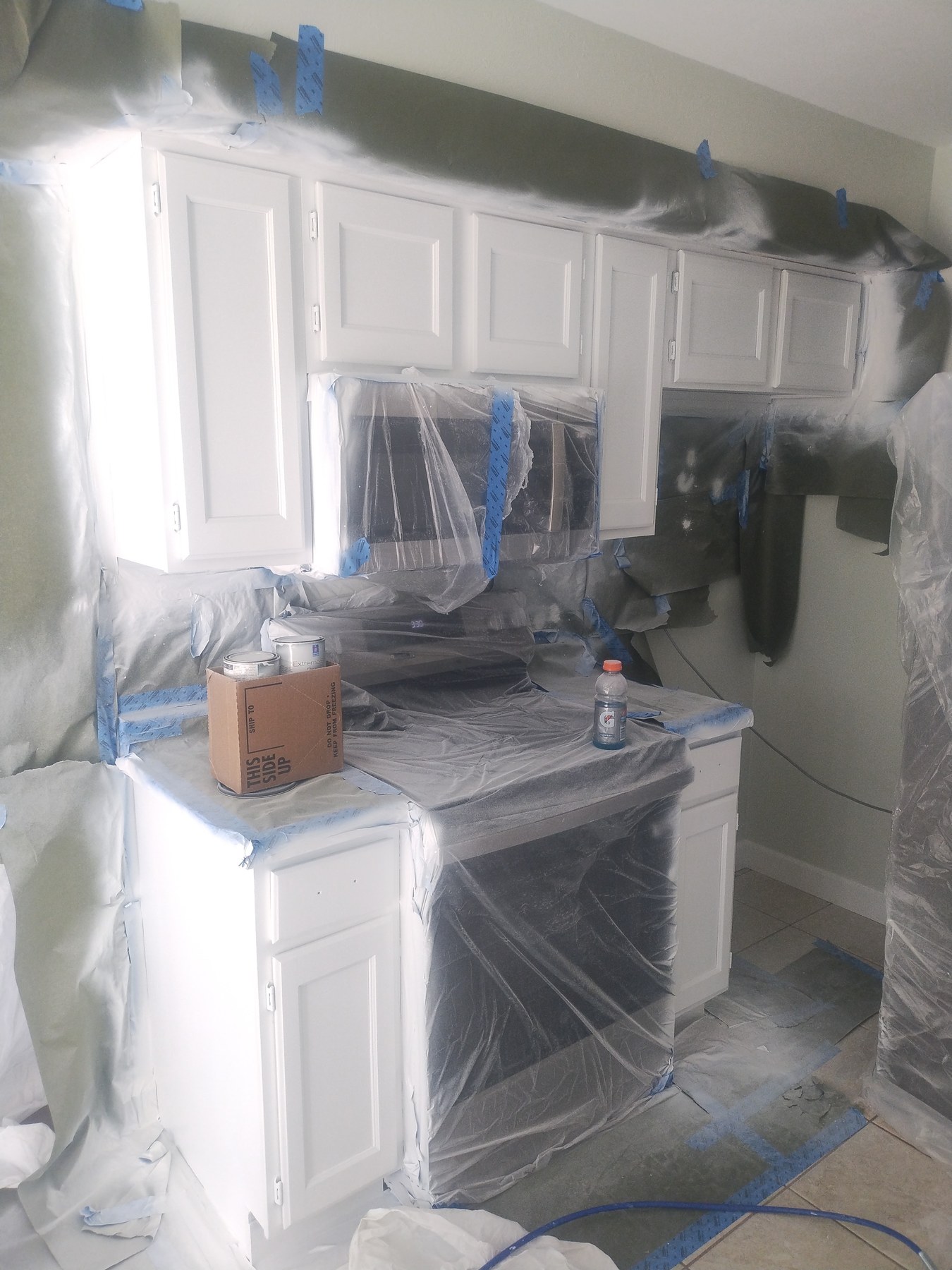 Protected kitchen cabinet refinishing