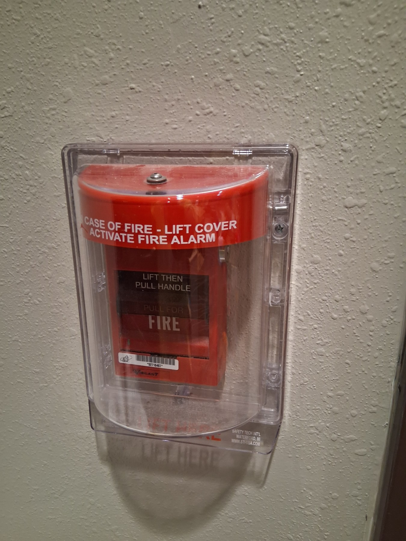 Commercial wall detail near a fire alarm