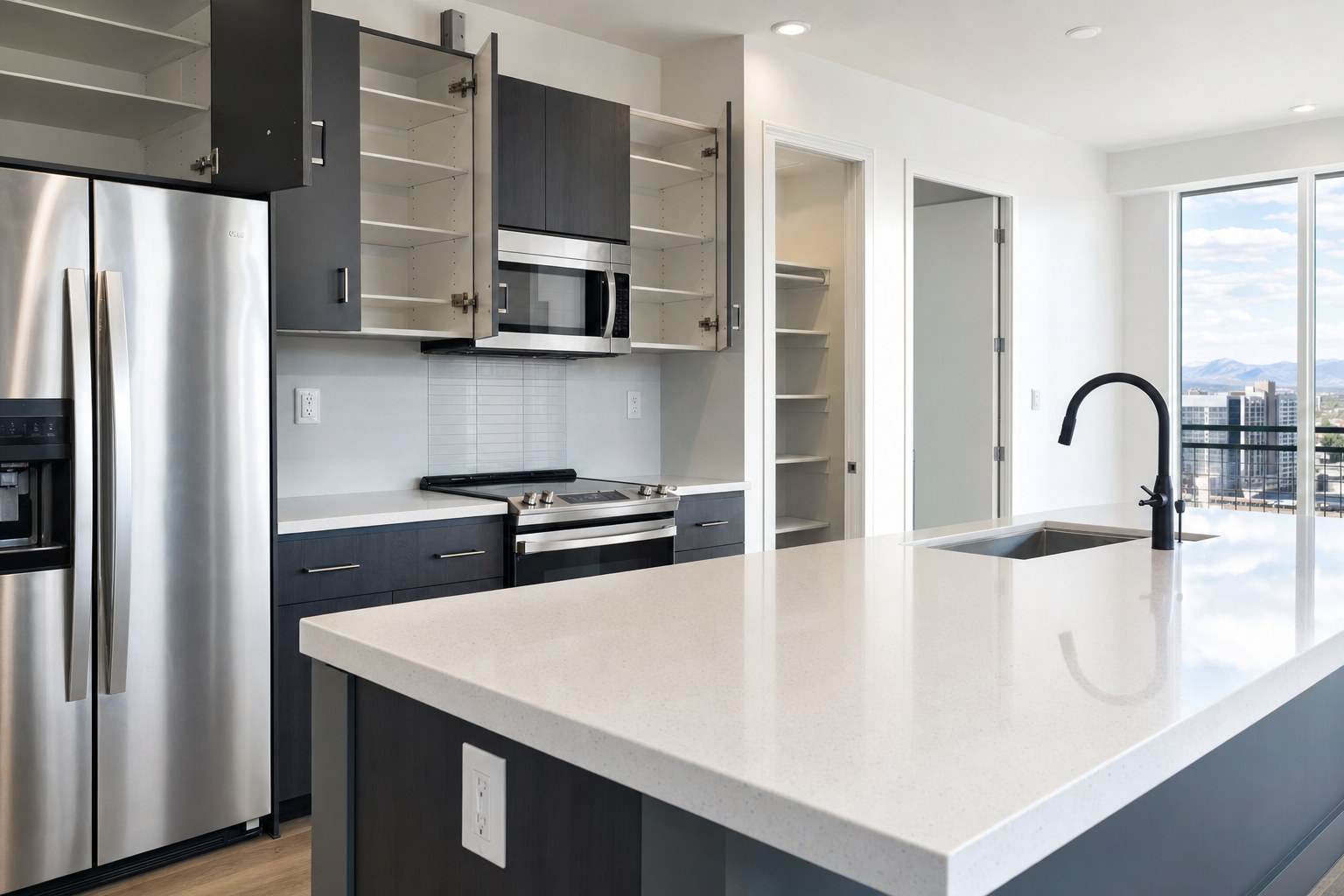 Clean vacant apartment kitchen with open cabinets