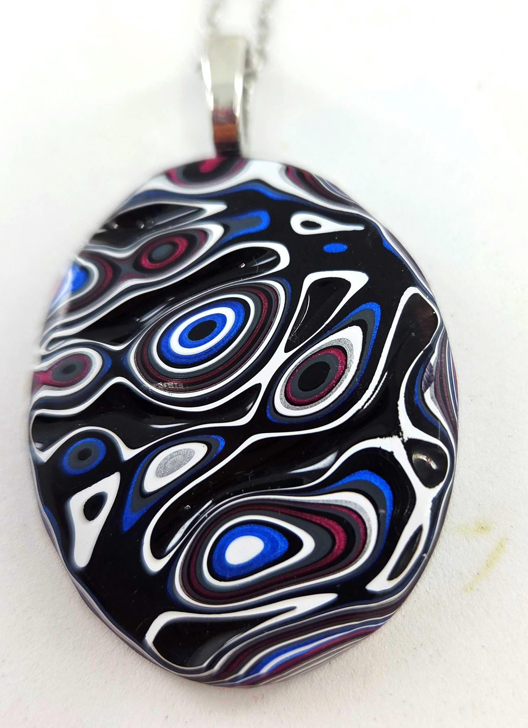 Fordite Pendant / Black Rivers, Islands of Blue, Purple, Red and White