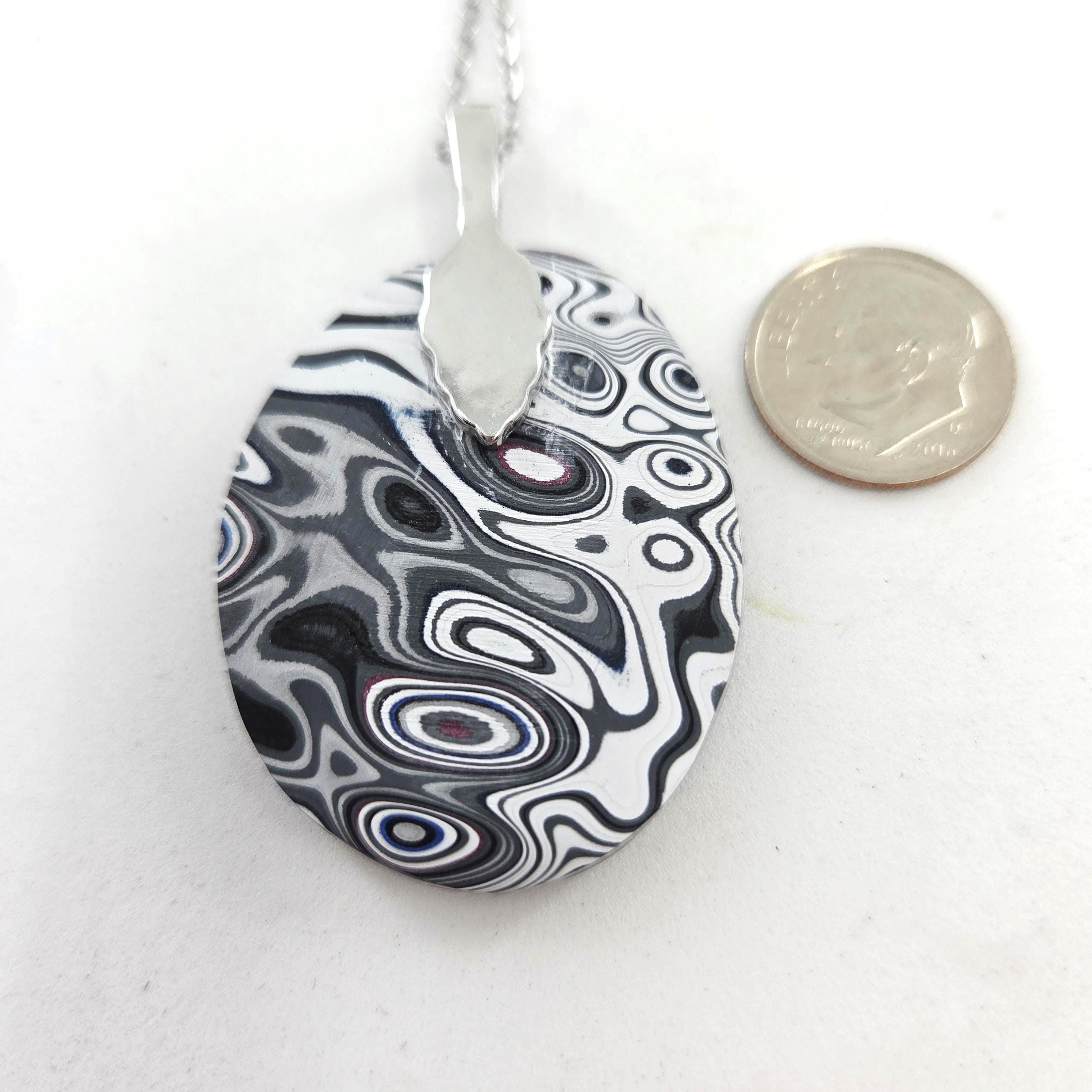 Fordite Pendant / Black Rivers, Islands of Blue, Purple, Red and White, view 2