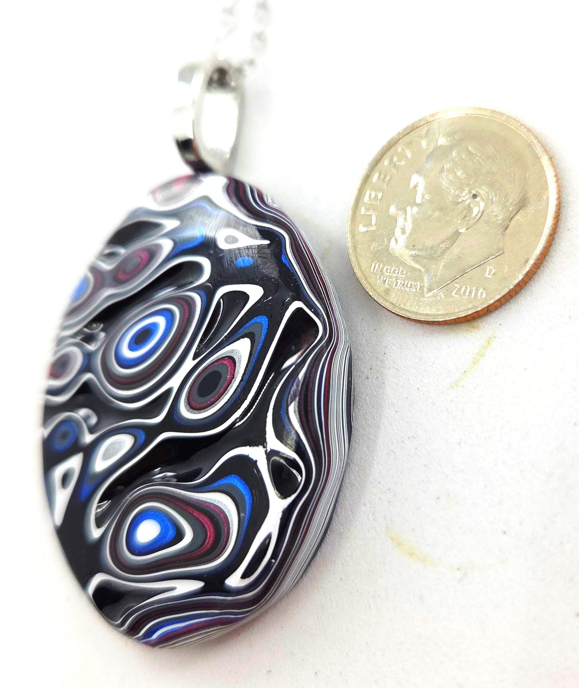 Fordite Pendant / Black Rivers, Islands of Blue, Purple, Red and White, view 3