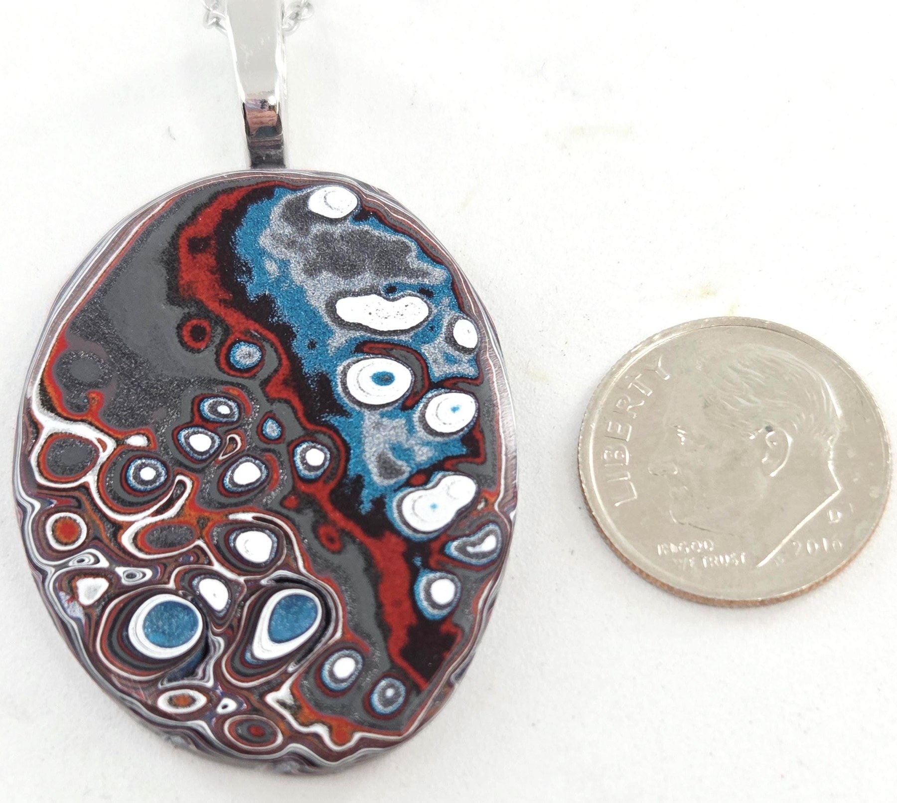 Fordite with Pools of Color Pendant, view 1