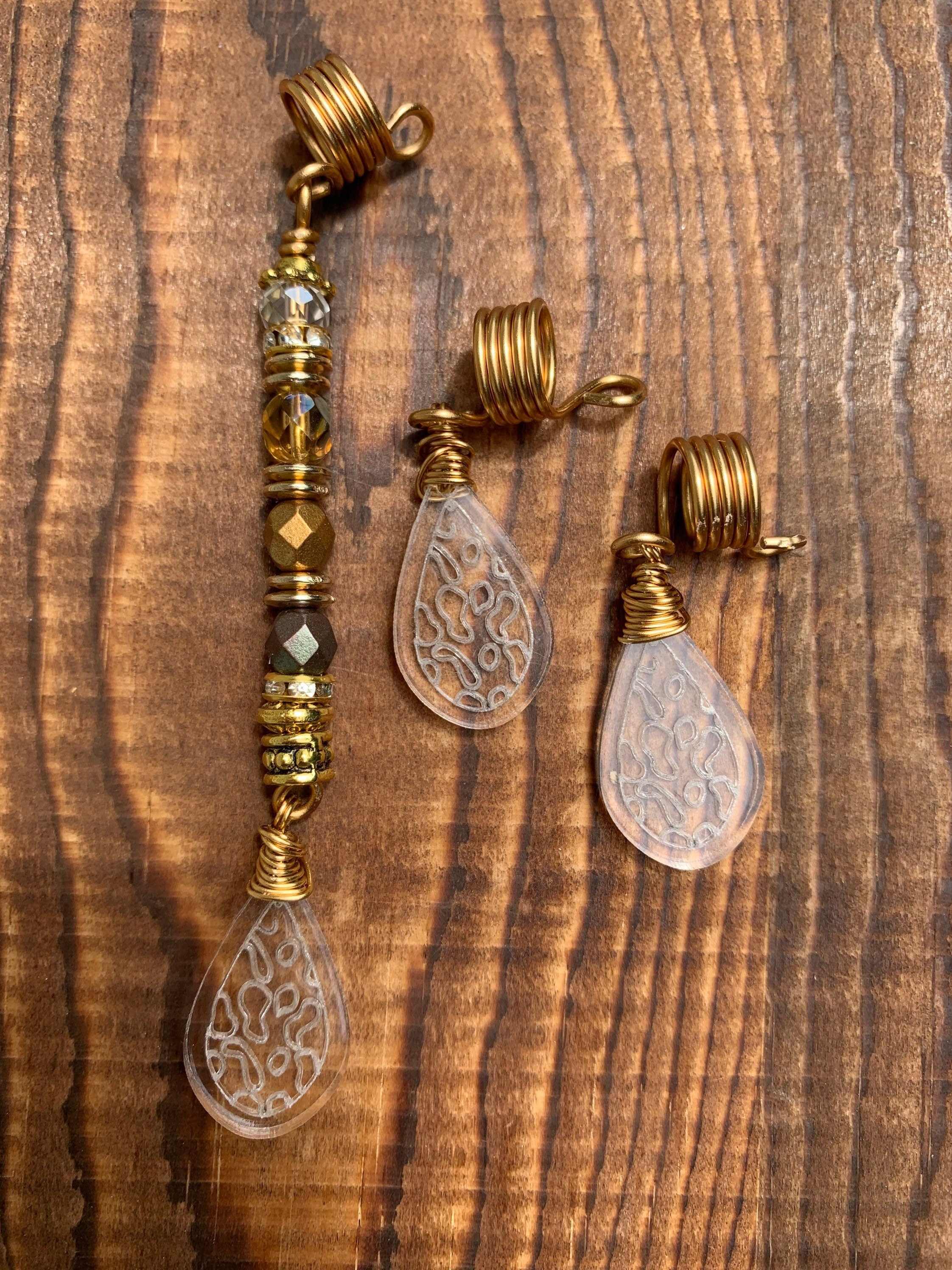 Gold-tone Sun Catcher loc cuff and charm set