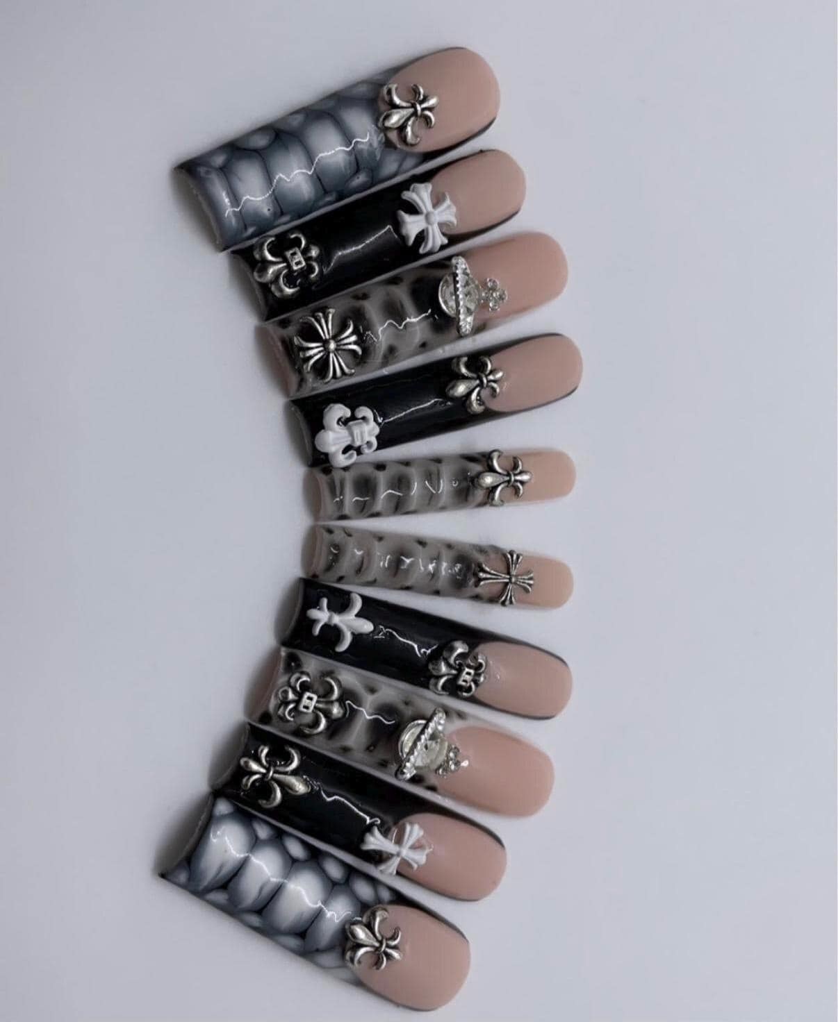 A detailed handmade BBJD press-on nail set