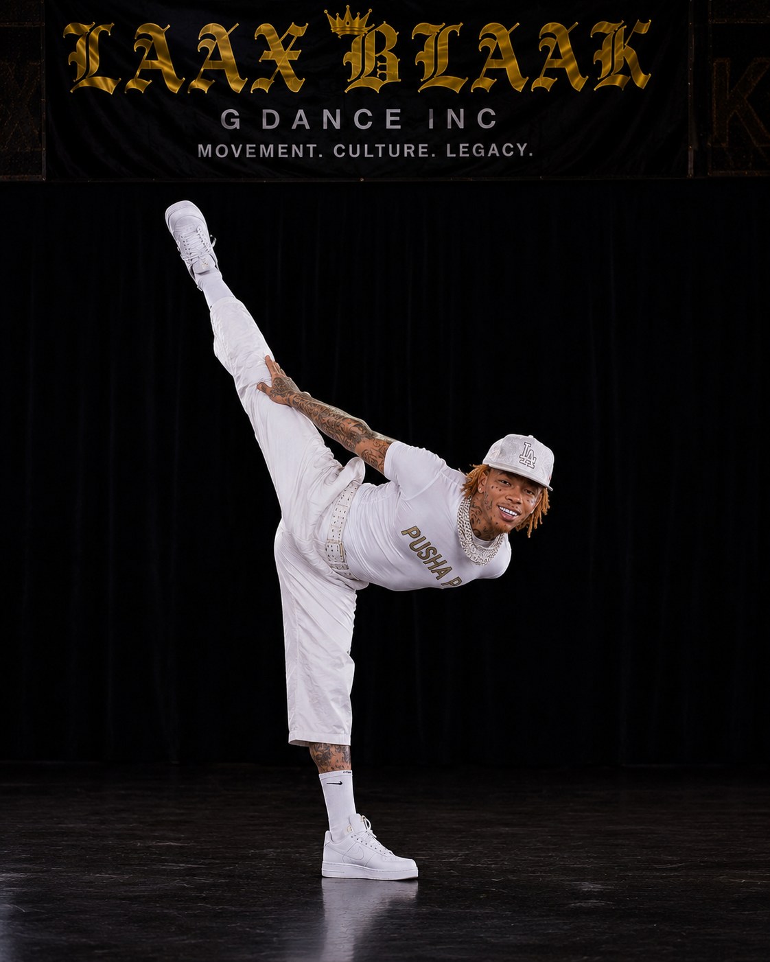 LAX BLaaK male dancer holding a high extension