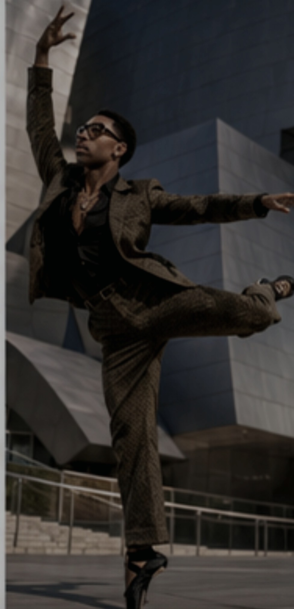 Dancer moving through an urban architectural setting