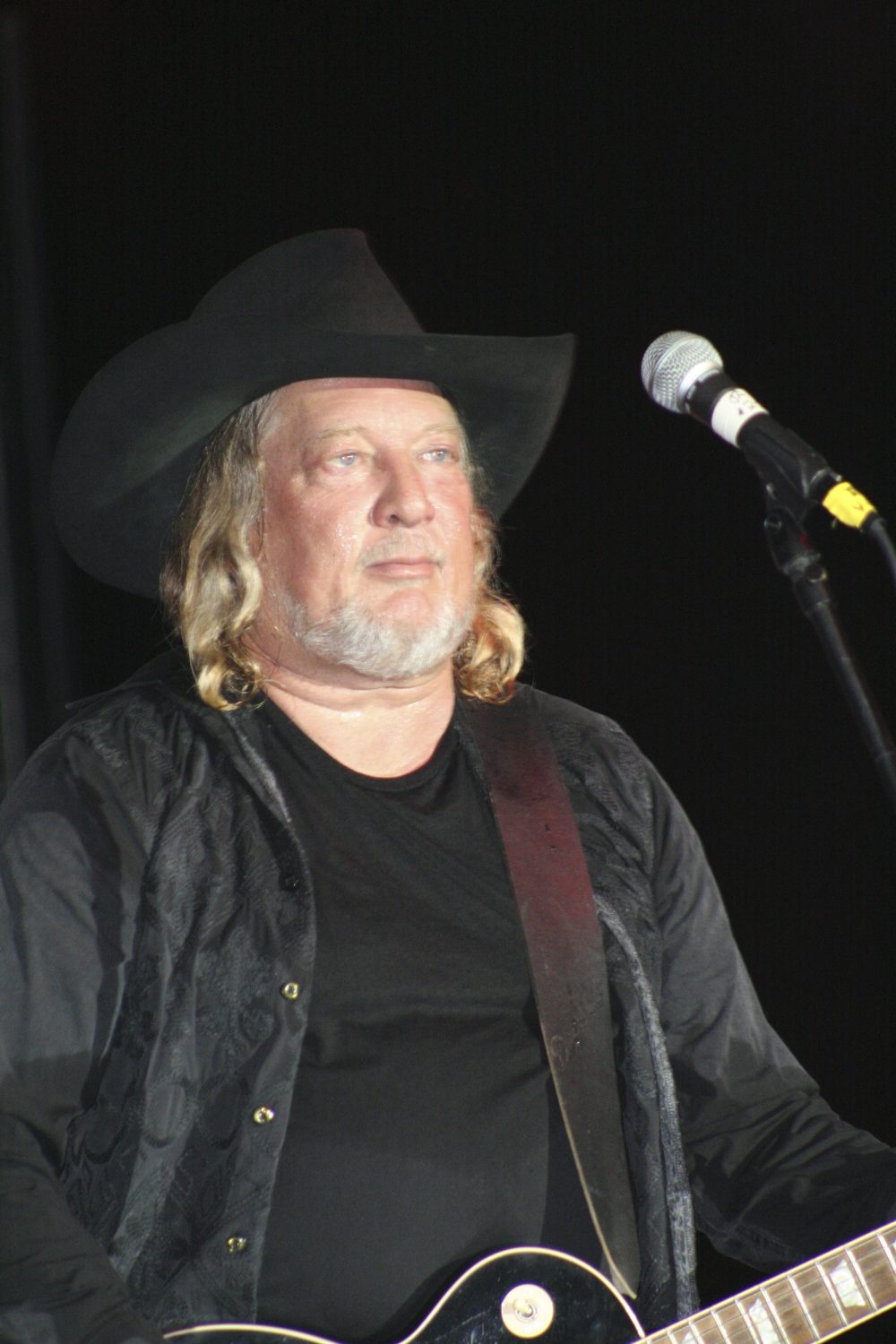 Country singer John Anderson performing with his guitar at the Pike County Fair in Missouri in 2008