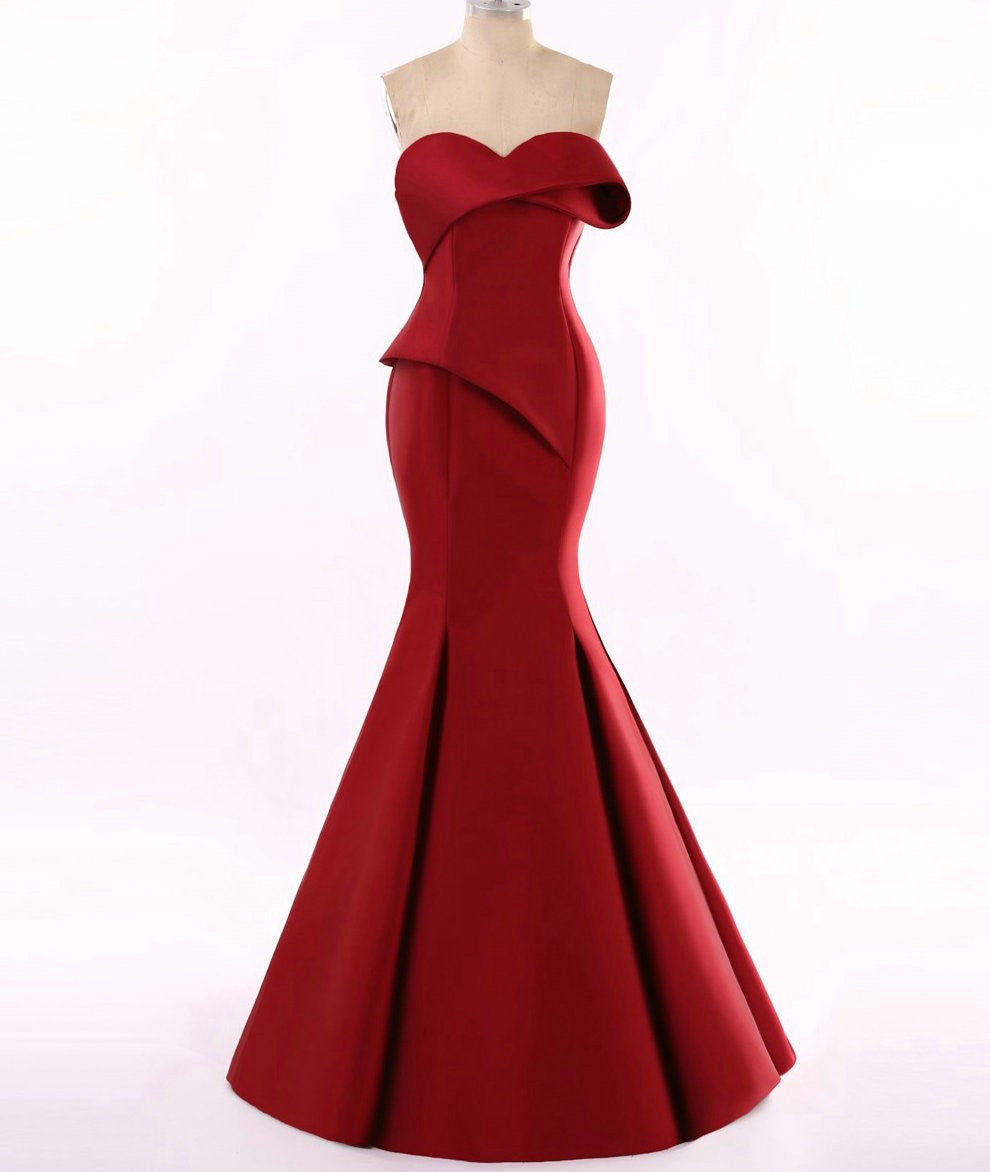 Deep red Darius Cordell fit-to-flare gown displayed on a dress form