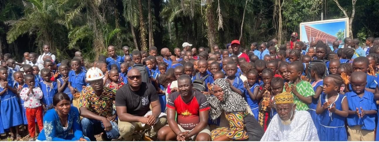 Community members gathered with MaCHO supporters in rural Sierra Leone