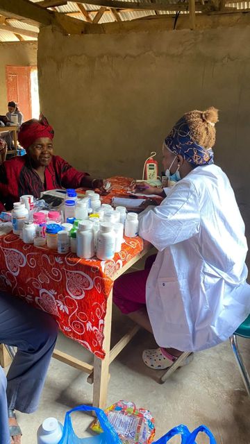 A clinician speaking with community members